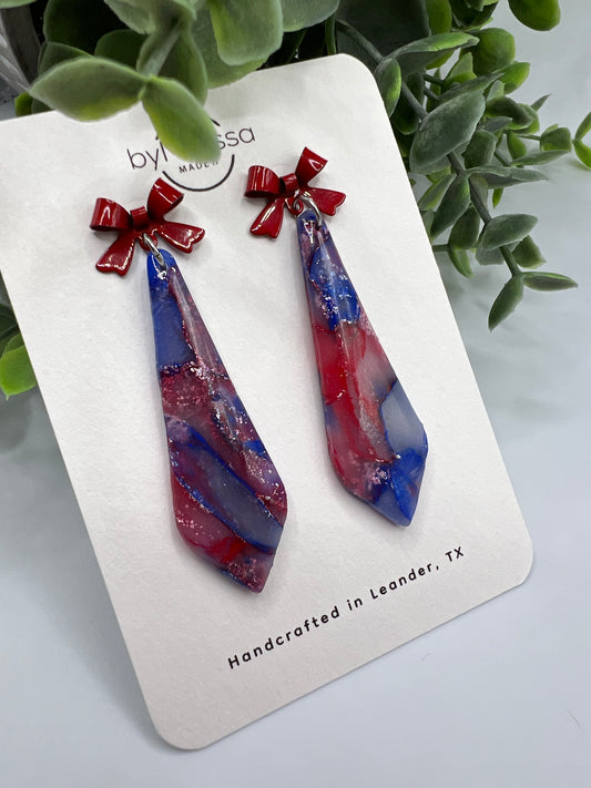 Red and Blue Skinny Small Elongated Kite Drop Earrings with Red Bows